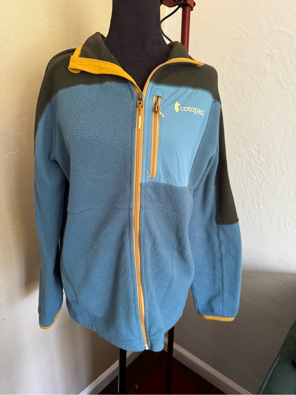 cotopaxi Light Blue Fleece Jacket with Yellow Trim and Olive Shoulders